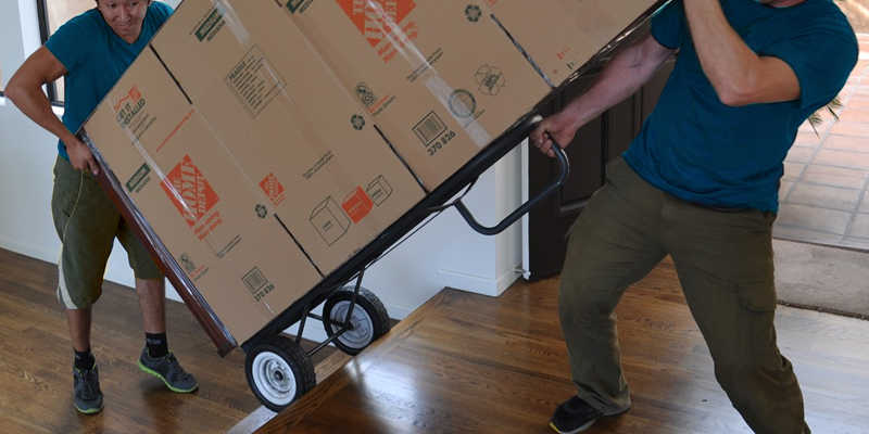 Picture of movers carrying a large piece of furniture